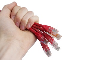 Cropped image of technician holding data cable plug over white background
